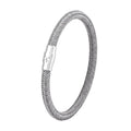 Geometric titanium steel bracelet with a magnetic clasp, shown in a unisex style.