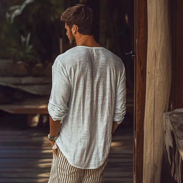 Beige long-sleeved slim-fit V-neck t-shirt made from a hemp blend fabric on a hanger.