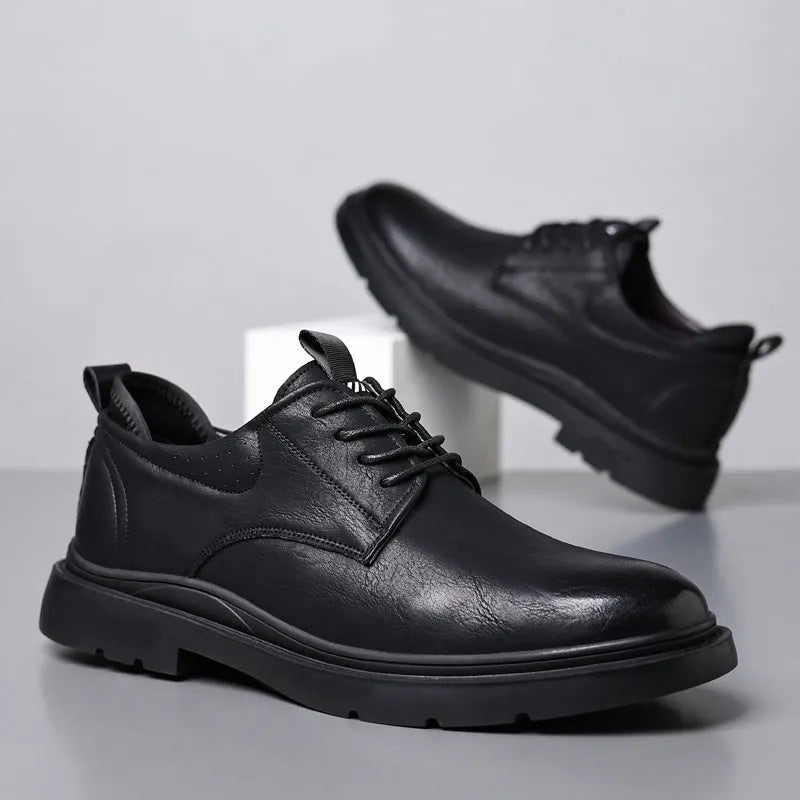 Men's black and brown leather sneakers with rubber sole and decorative sewing line detailing on cowhide upper