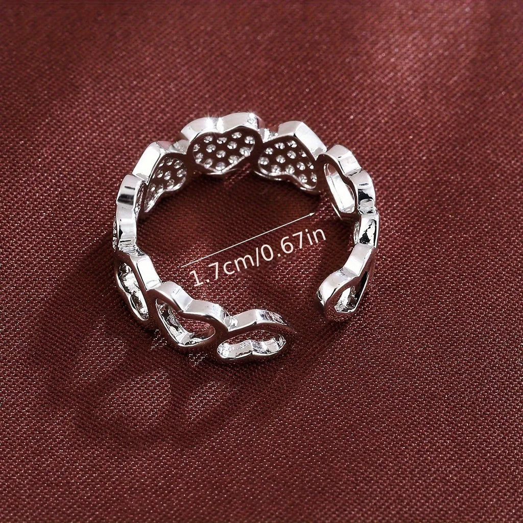 Adjustable opening copper ring with love heart geometry design in gold or silver finish.