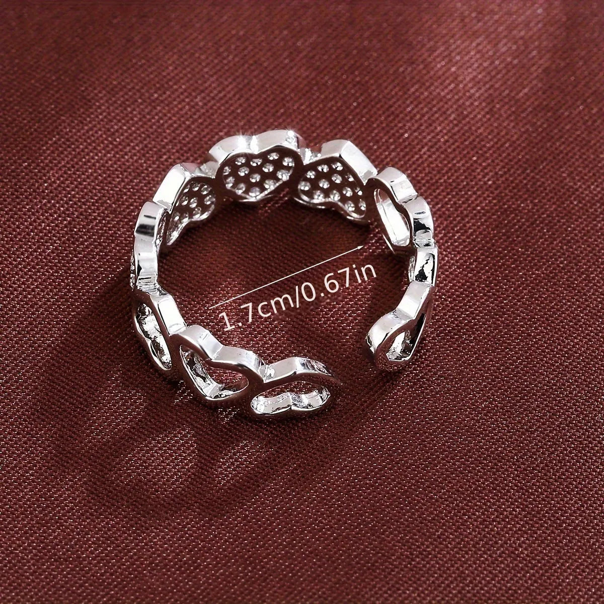 Adjustable opening copper ring with love heart geometry design in gold or silver finish.