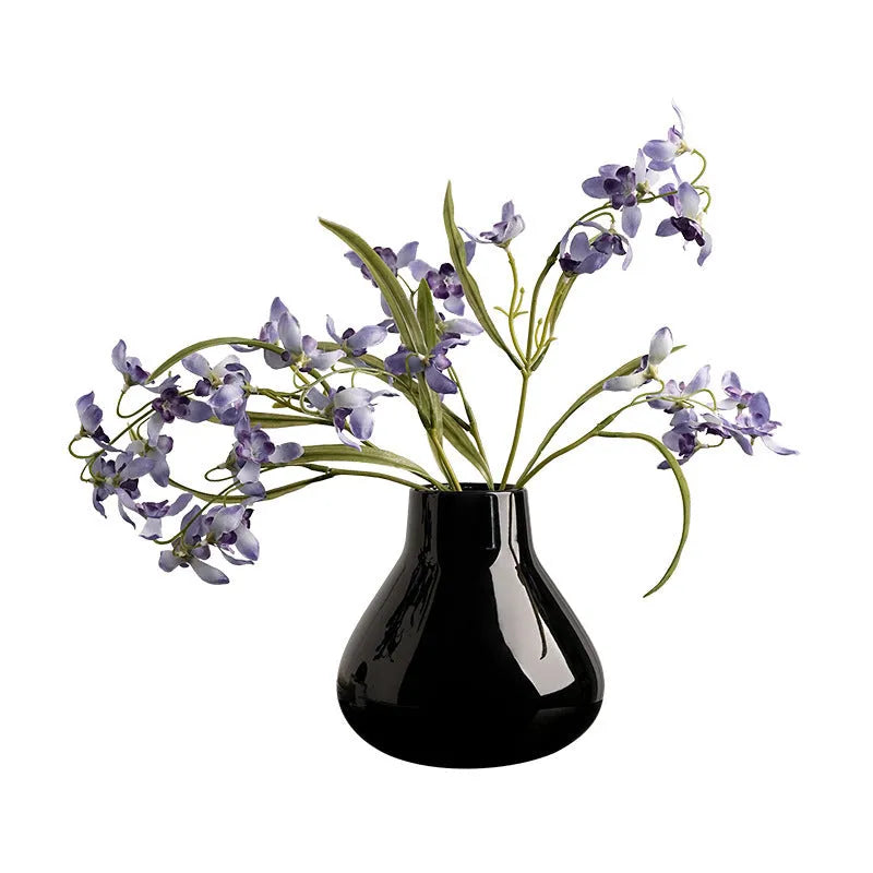 Ceramic decorative vase with orchid flowers in modern simplicity style