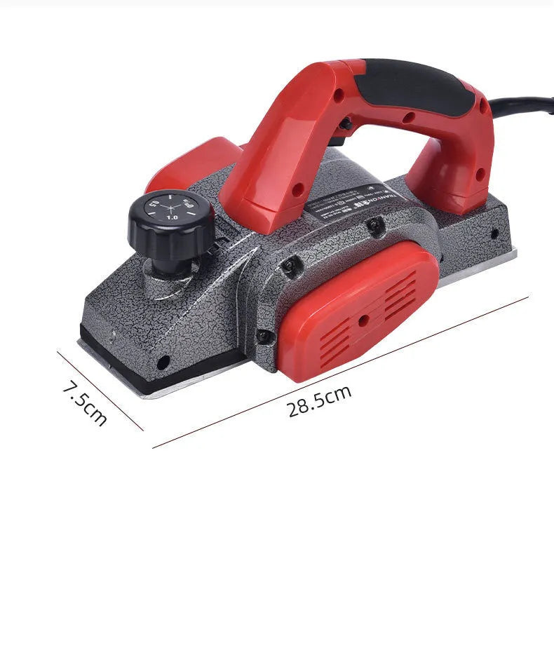 Red desktop electric wood planer with aluminium shell showing 82mm cutting width