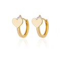 Simple silver-tone heart-shaped stud earrings with zircon stones on a white background