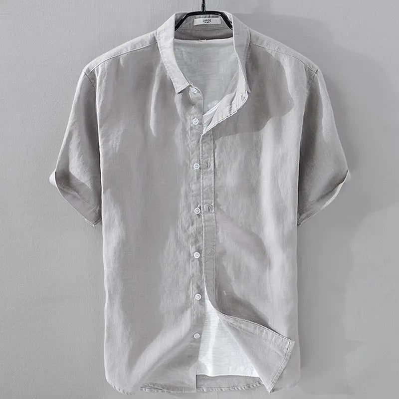 Men's loose fit short sleeve shirt in a cotton linen blend fabric, shown in a solid colour.