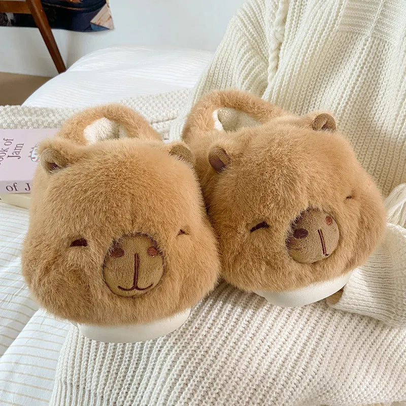 Light brown women's winter slippers with plush upper, artificial wool lining, and PVC sewn soles