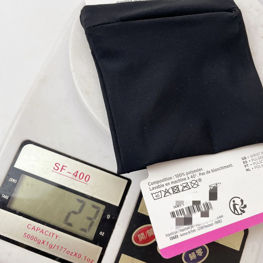 Black wrist bag armband sleeve for mobile phone storage, shown on a wrist.