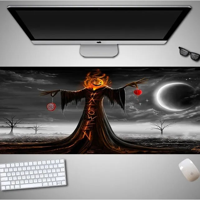 Oversized Halloween graphic cloth mouse pad on a desk, showing non-slip rubber base.