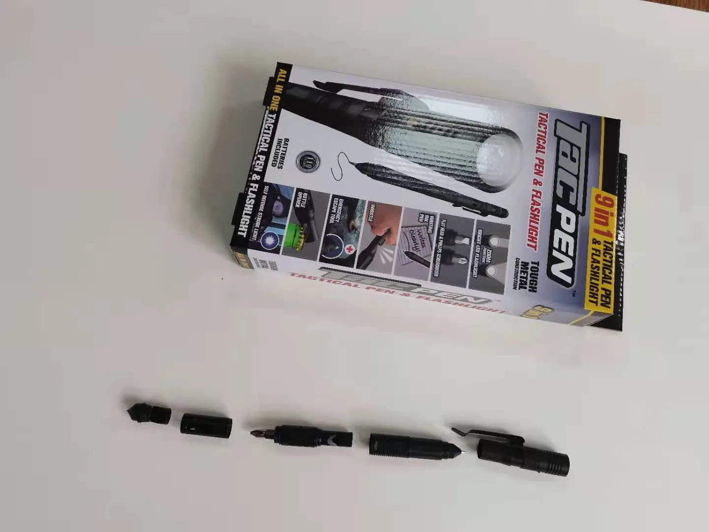 Black nine-in-one multi-function flashlight pen with car window breaker and dual light source for EDC outdoor use
