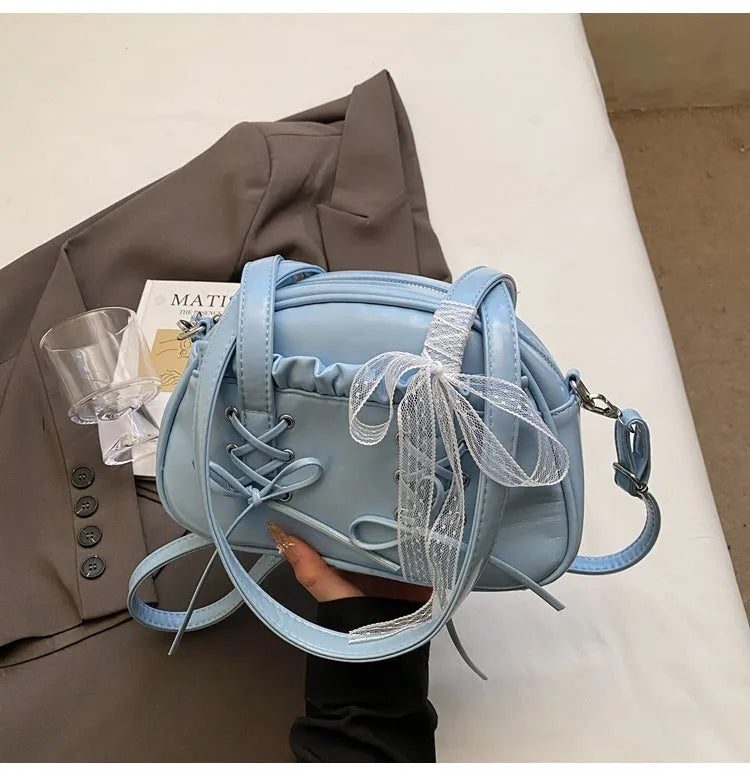Women's casual PU shoulder handbag with a bandage bow and internal phone pocket in beige, black, blue, or pink.