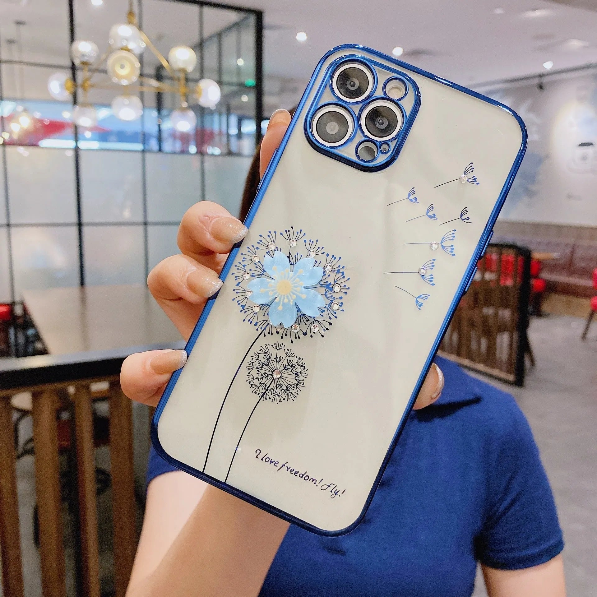 Green 3D floral patterned iPhone case with a silver rotating ring stand on the back.