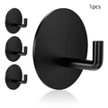 Stainless steel round self-adhesive hook for wall mounting.