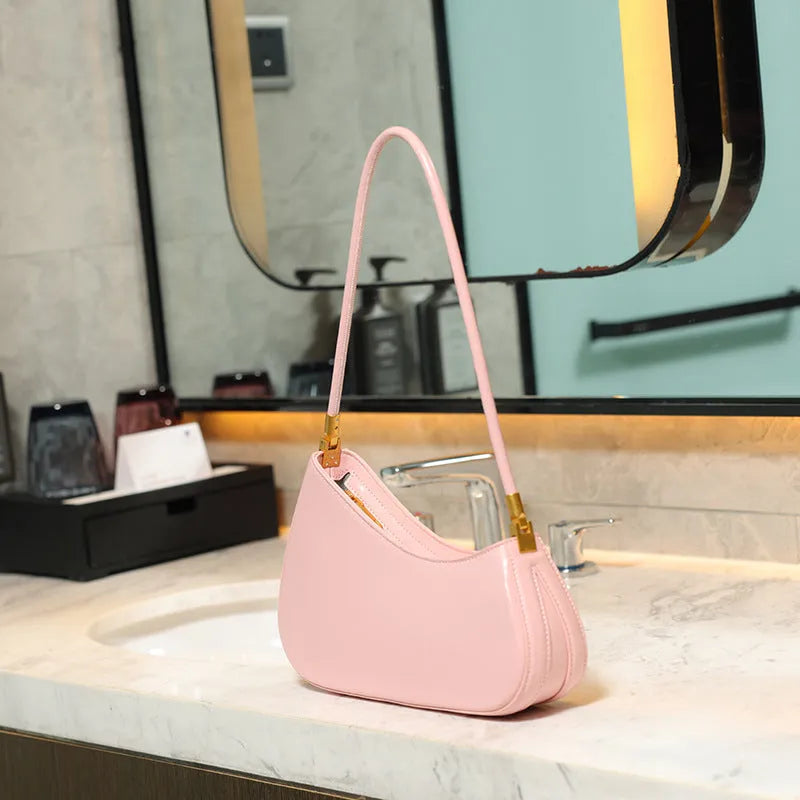 Women's retro oval underarm bag in PU with single strap and internal zip compartment, shown in multiple colour options