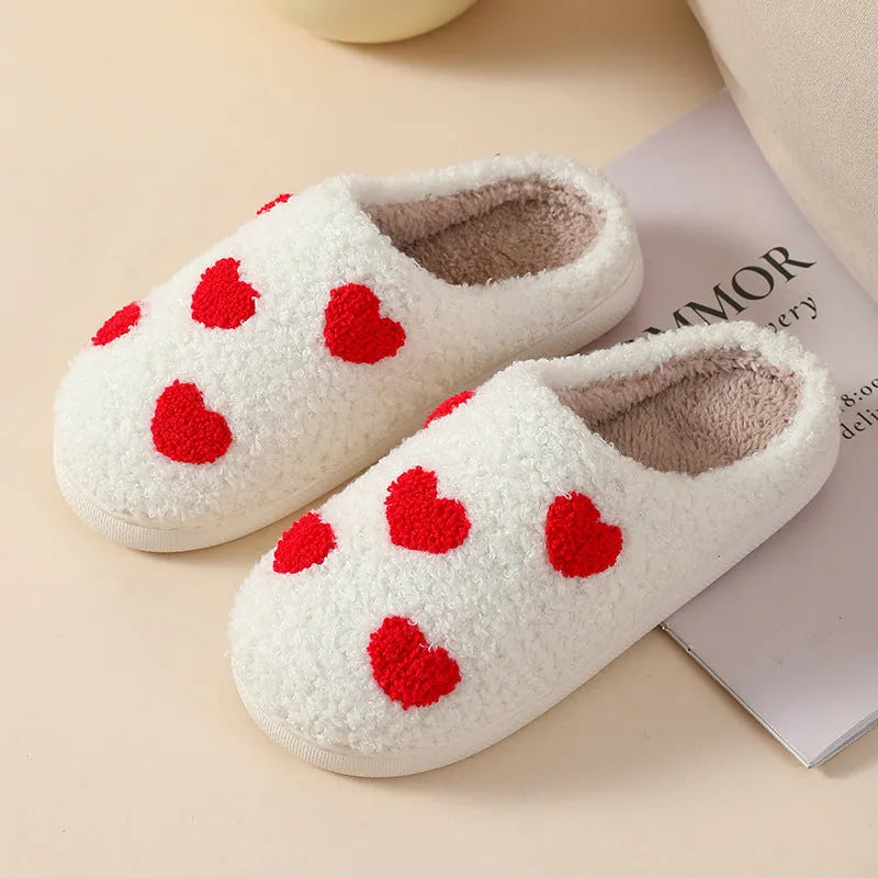 Women's plush slippers with cartoon love patterns and PVC non-slip soles in multiple colour options