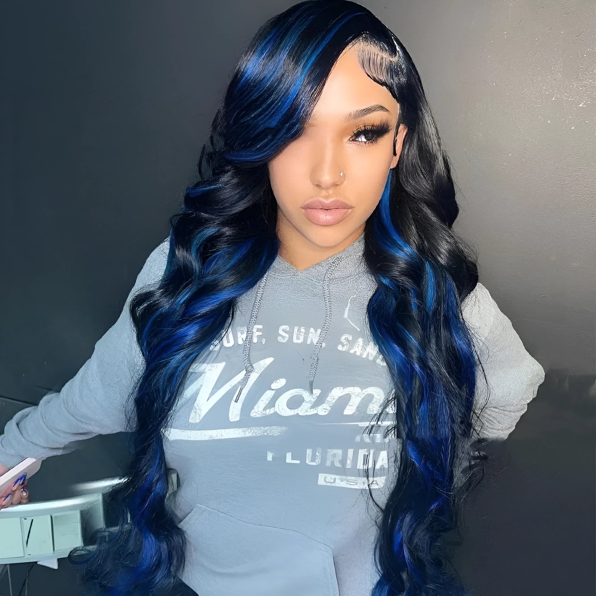 A woman wearing a Star Fashion style human hair lace front wig with a 4x4 lace frontal.