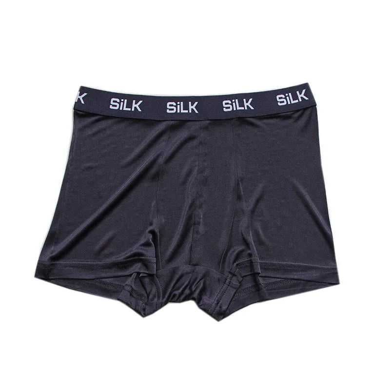 Men's loose-fitting silk shorts in navy blue on a mid-waist.