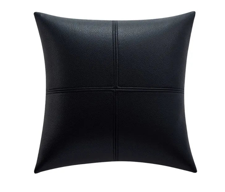 Simple solid colour cowhide leather pillow cover on a sofa, shown in a beige white colour.