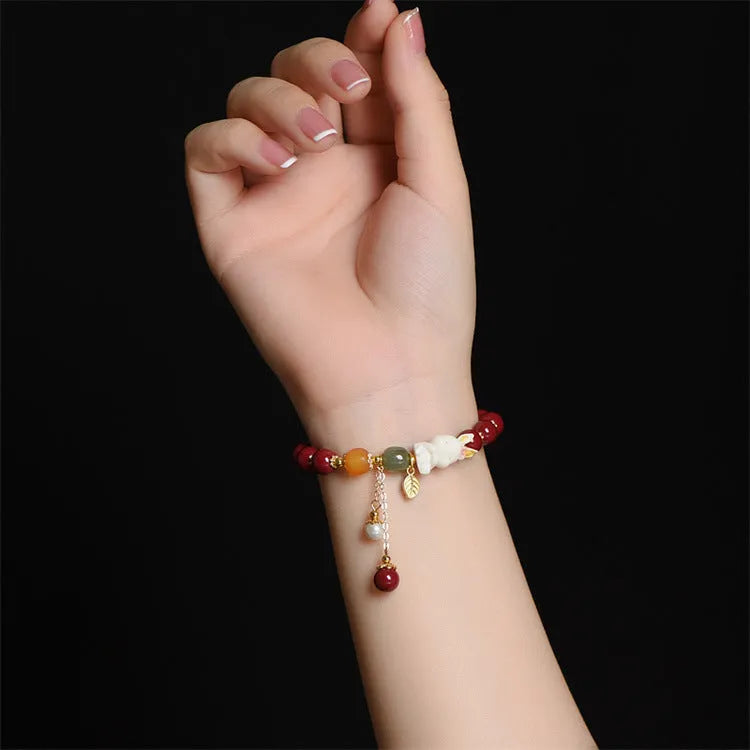 Natural cinnabar rabbit bracelet for women in national style, shown in 8mm and 10mm size options.