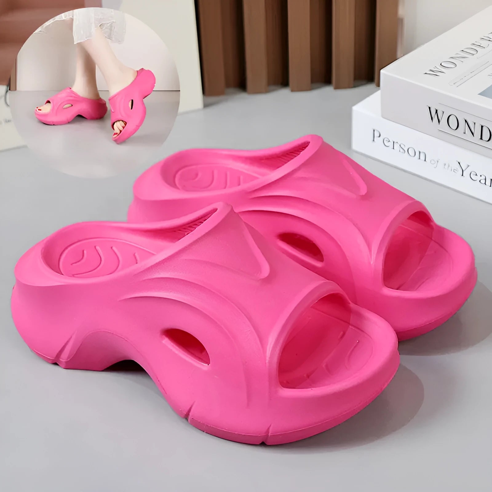 Women's white EVA slippers with a thick sole on a sandy beach background
