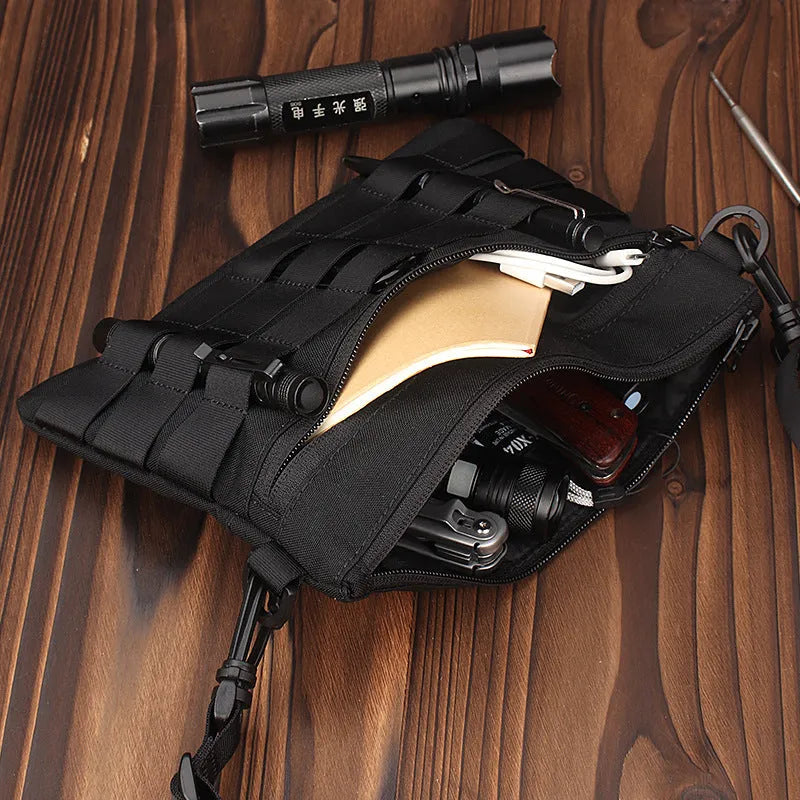Black tactical waist pack made from Oxford cloth measuring 18cm by 3.5cm
