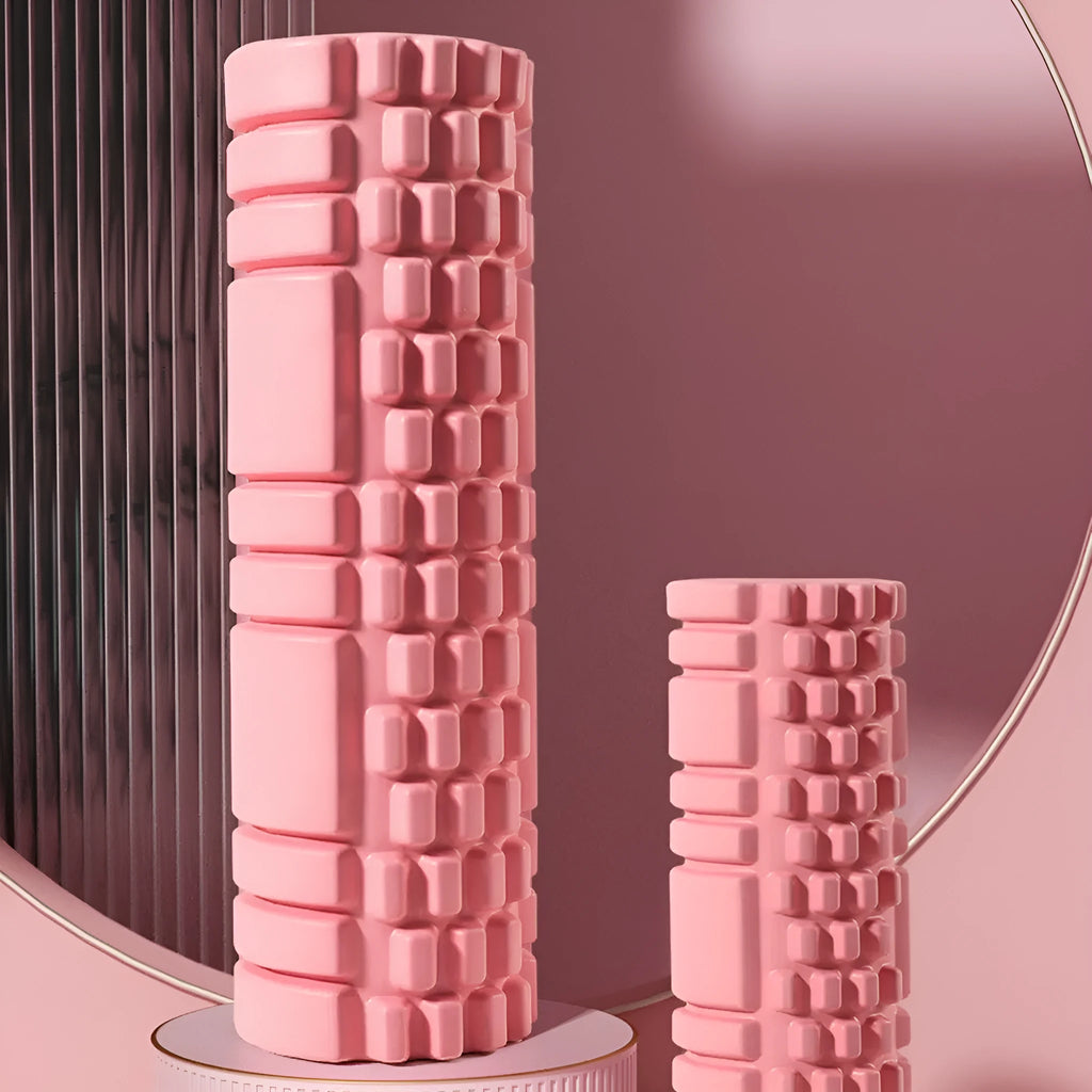 EVA foam roller for fitness in various colours and sizes on a gym floor.