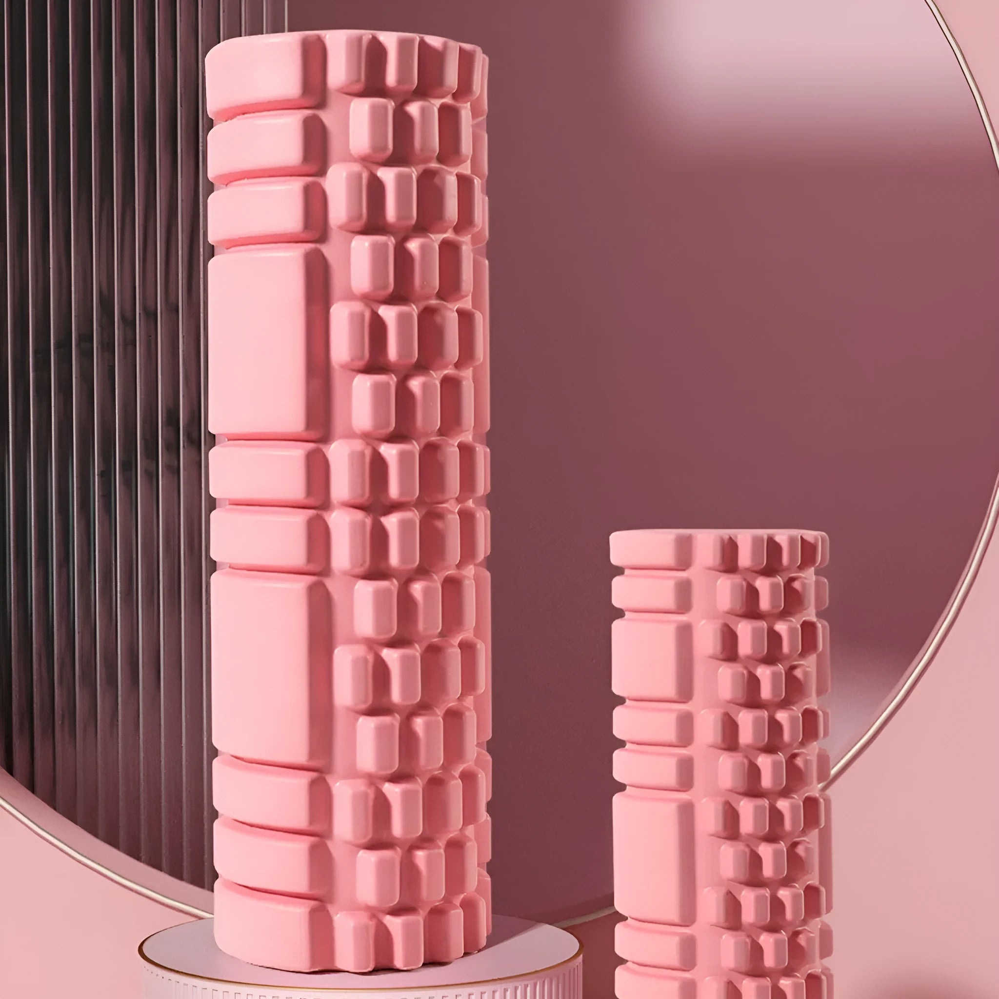 EVA foam roller for fitness in various colours and sizes on a gym floor.