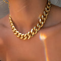 Gold-coloured thick chain necklace for women, measuring 32cm in length.