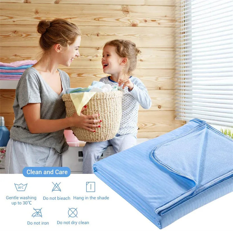 A blue polyester cooling blanket with Q-Max 0.4 technology laid on a bed.
