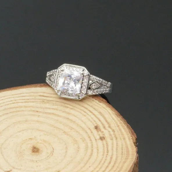 Women's geometric zircon ring with hollow design and platinum colour finish showing quadrilateral decorative elements