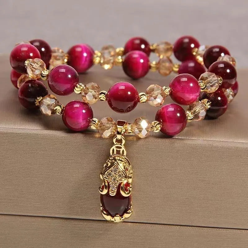 Handmade Vanves Stone Tigereye bracelet on wrist, showing single and double chain options with fox and leather charms.