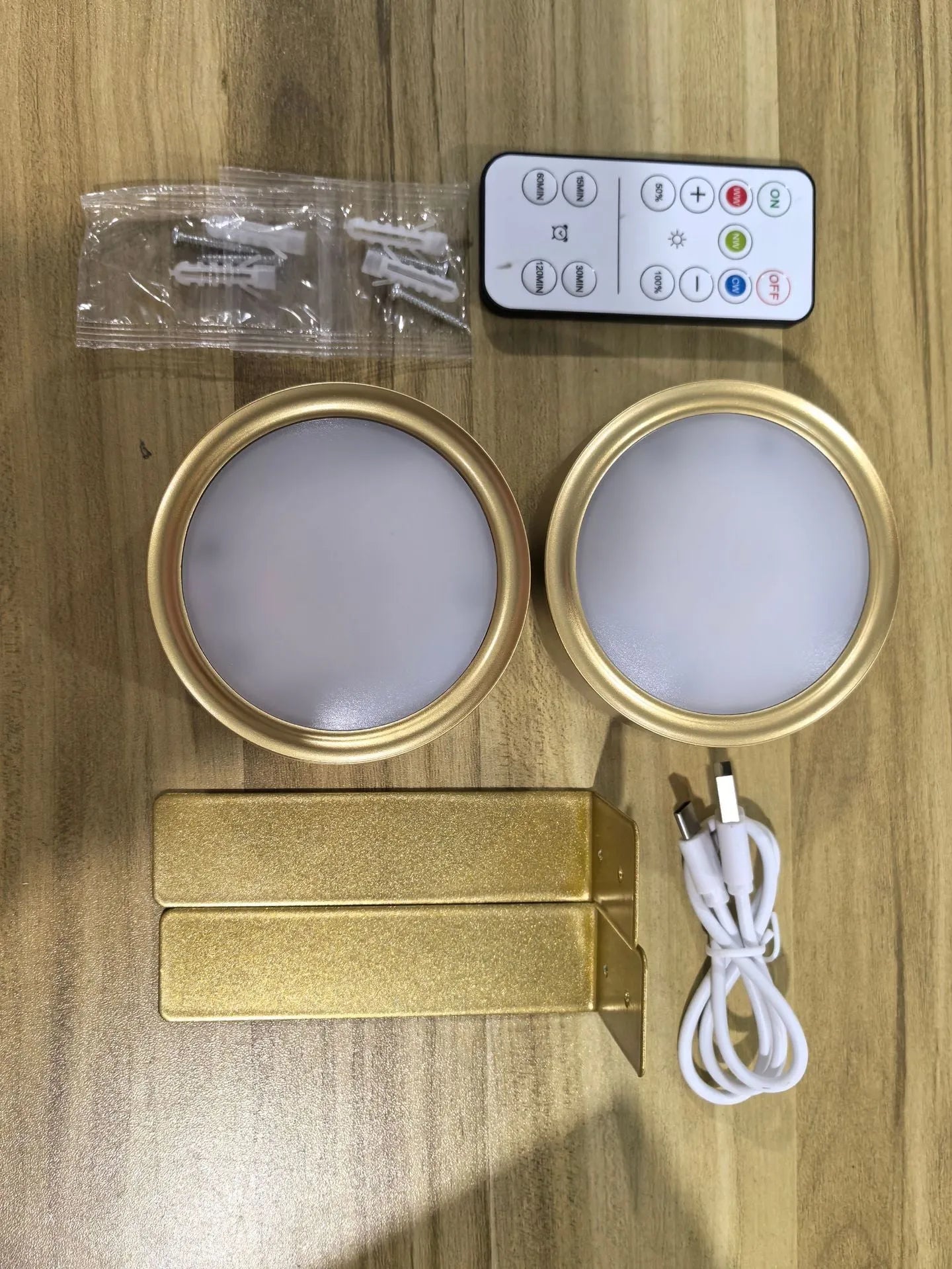 Wireless LED painting lamp with a magnetic mounting belt and remote control in black finish.