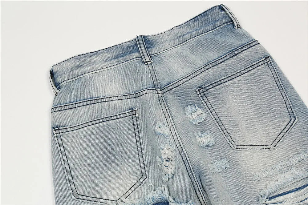 Men's light blue flared washed denim jeans with zipper fly on a model