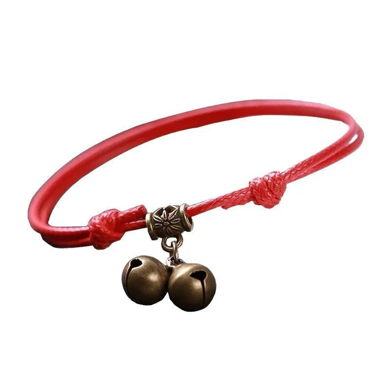 Adjustable nylon dog halter collar with brass bell shown in black rope colour fitting small dog