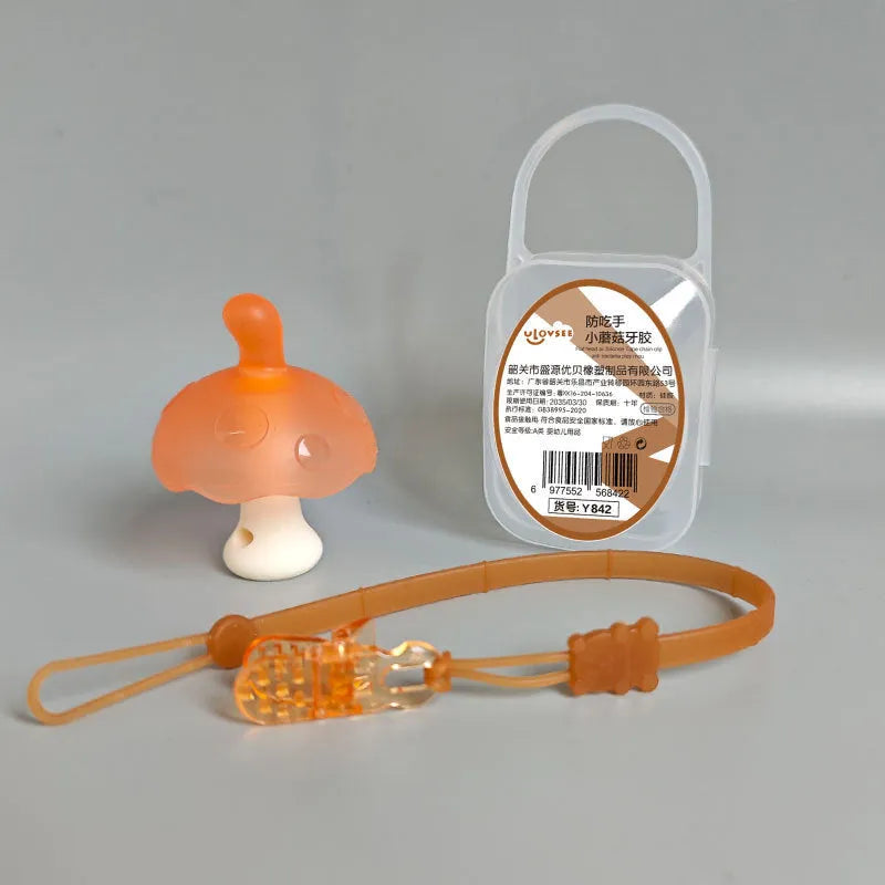 Small latex mushroom gum silicone toy in a transparent box with a chain.