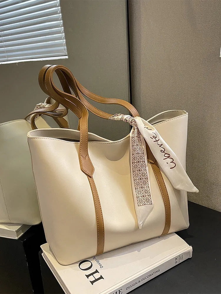 Canvas bucket tote bag with crossbody strap showing sandwich pocket organisation and soft construction