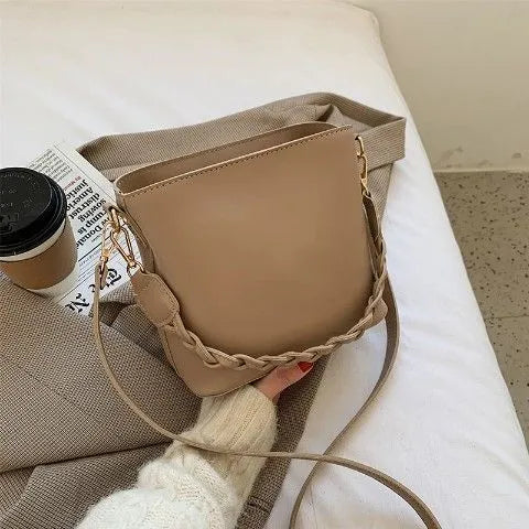 Woven PU one-shoulder crossbody bucket bag in retro style, shown in khaki colour.