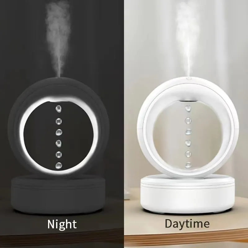 White round anti-gravity air humidifier with levitating water droplets on a desk, USB powered