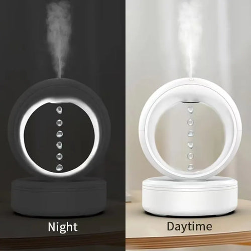 White round anti-gravity air humidifier with levitating water droplets on a desk, USB powered