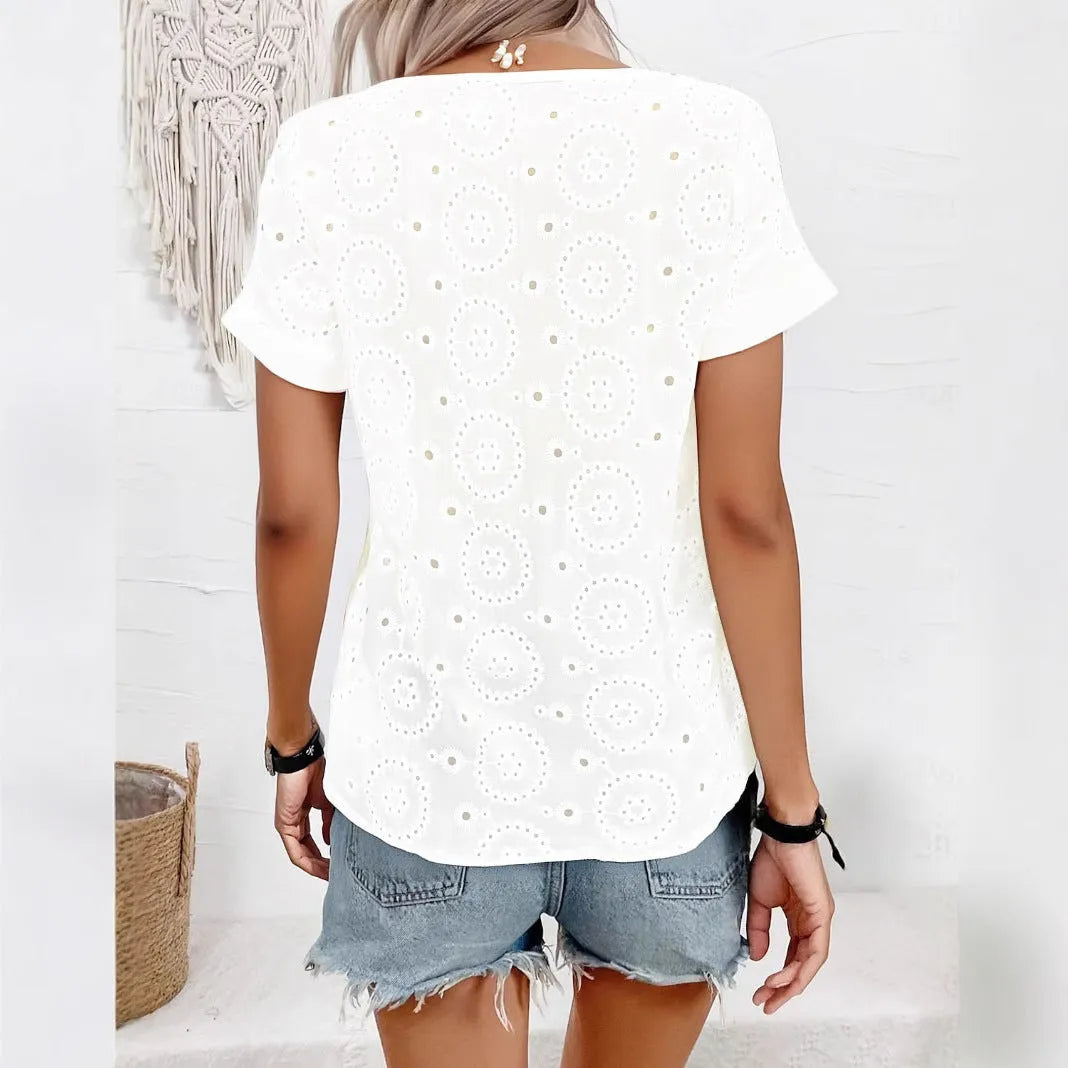 White women's V-neck short sleeve T-shirt with a hollow design detail and loose fit.