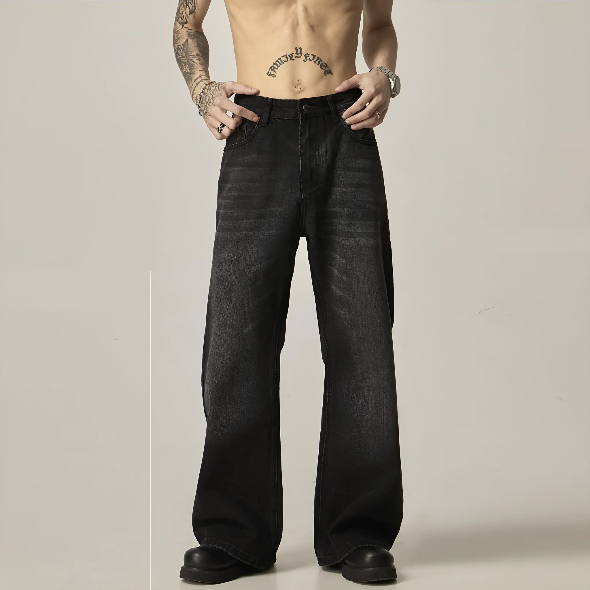 Black loose-fit straight-leg men's jeans with a zipper fly and retro styling.