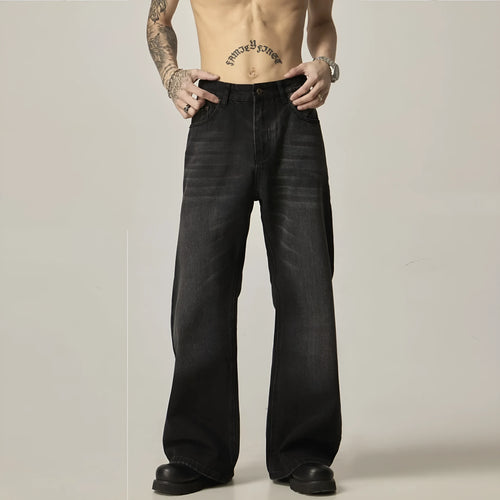Black loose-fit straight-leg men's jeans with a zipper fly and retro styling.