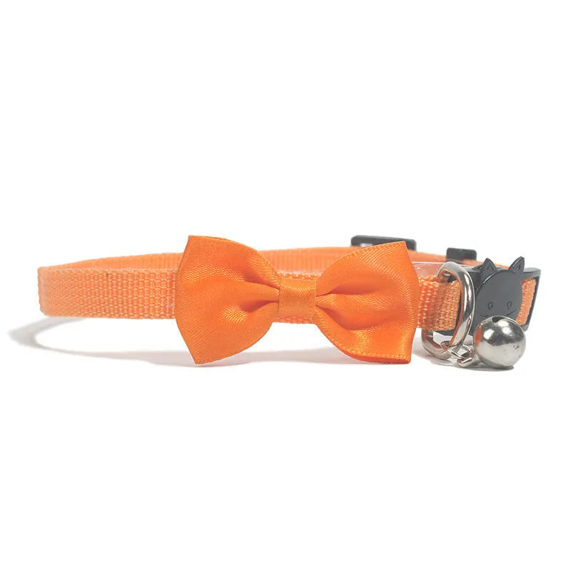 Striped multi-colour adjustable nylon cat collar with a small bell attached.