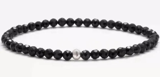Geometric agate bracelet with obsidian, blue San, and black agate stones on wrist