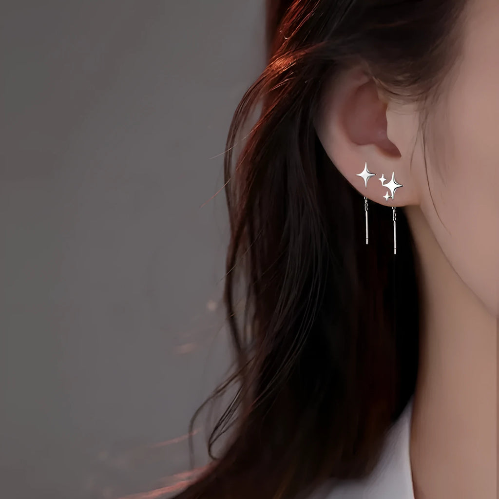 Asymmetric four eight-pointed stars hanging earrings in copper for women