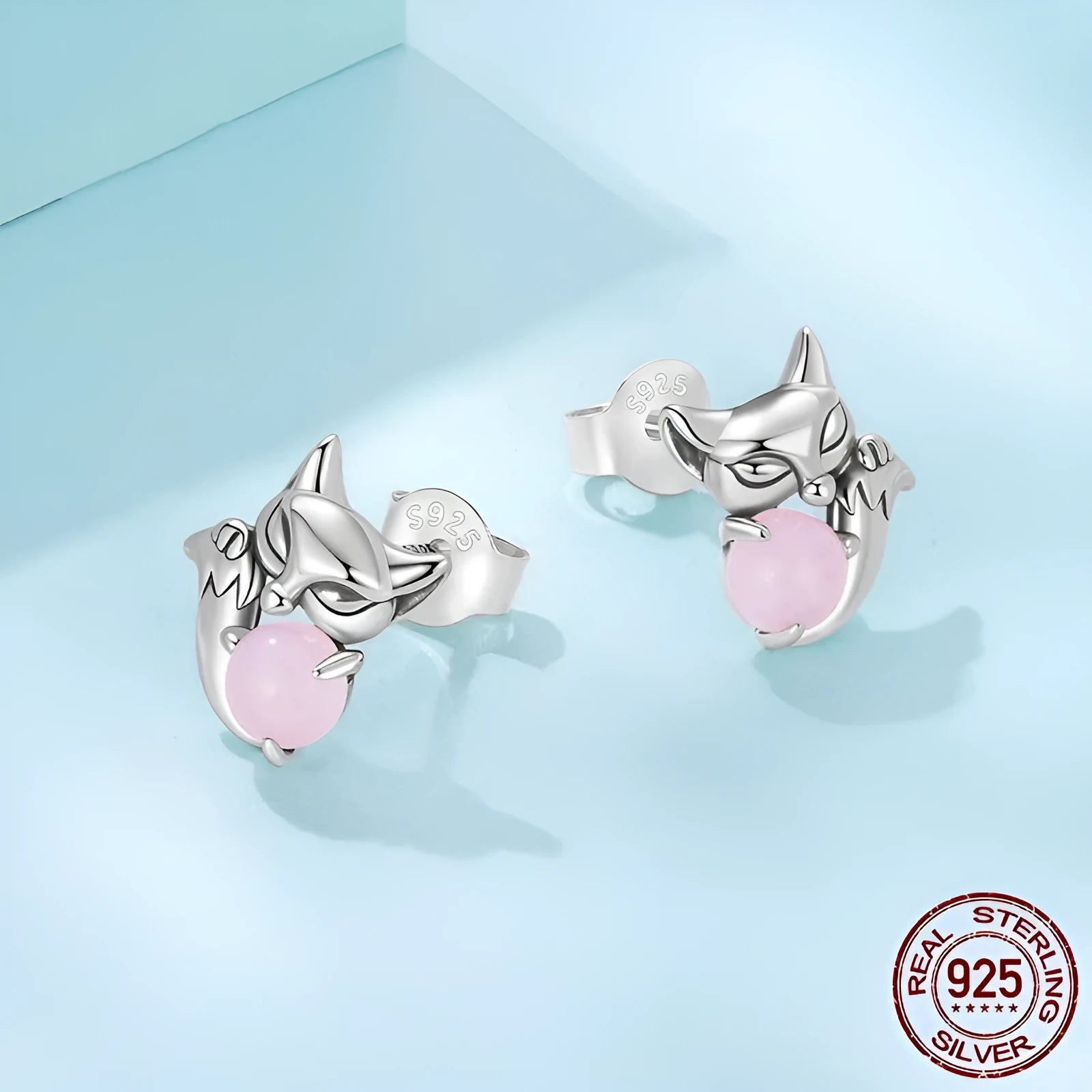 S925 sterling silver fox stud earrings with green jade inlay on white background