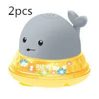 Automatic water-sensing whale bath toy with spray, lights, and music functions for baby bath time