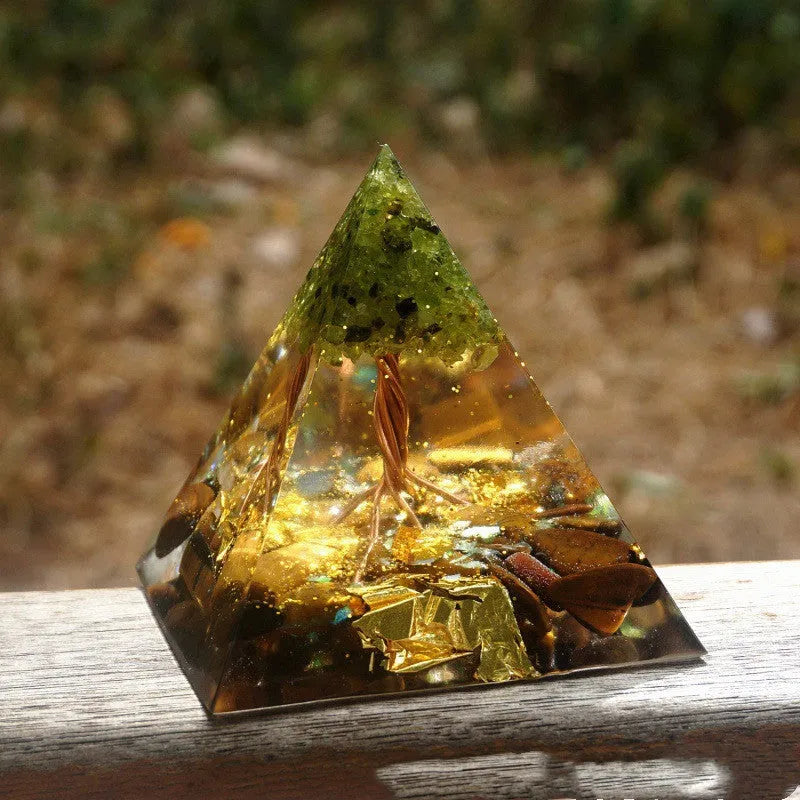 Clear epoxy resin pyramid ornament with embedded blue lapis lazuli crystal gravel, 6cm tall.