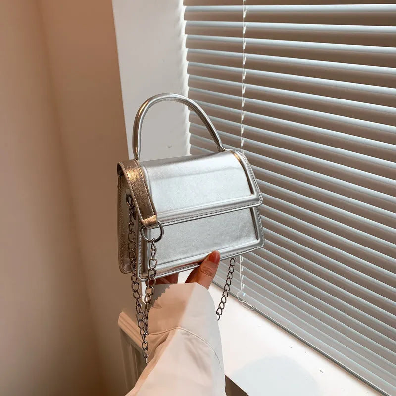 Retro PU crossbody shoulder bag in horizontal square shape showing sewing line details