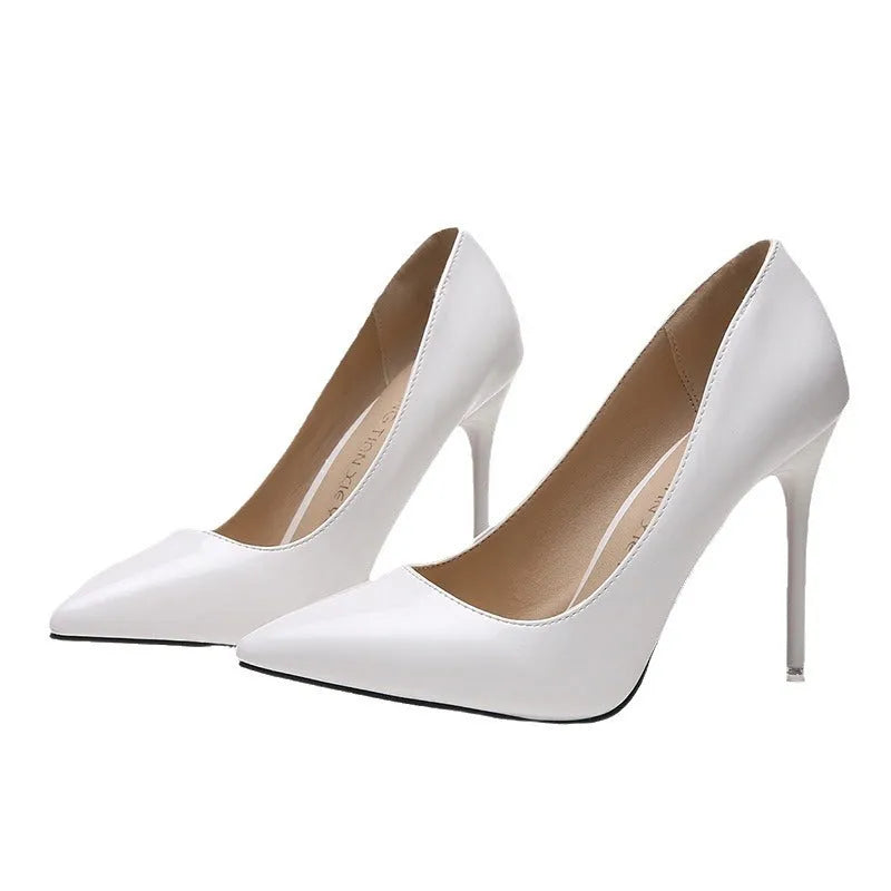 Women's pointed toe high heel pump with a stiletto heel above 8cm, shown in a nude colour with a buckle detail.