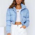 Women's loose-fit polyester jacket in blue, shown with long sleeves and a casual design.